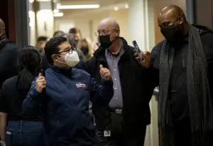 Mayor Pro Tem Eric Guerra, left, arrives with a thumbs up for the Homeless Point-In-Time (PIT) Count on Feb. 24, 2022 at California State University, Sacramento.