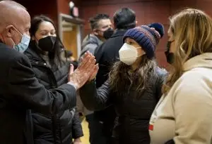 Mayor Darrell Steinburg high-fives Karina Talamantes, Chief of Staff for Vice Mayor Ashby before the Homeless Point-In-Time (PIT) Count on Feb. 24, 2022 at California State University, Sacramento.