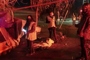 Volunteers make contact with people experiencing homelessness on X Street during the Homeless Point-In-Time (PIT) Count on Feb. 24, 2022