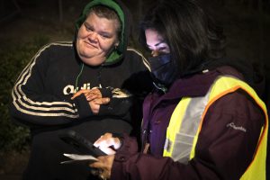 Jessica Hurd, left, who is experiencing homelessness speaks with Lourdes Castro Ramirez on X Street during the Homeless Point-In-Time (PIT) Count on Feb. 24, 2022. Ramirez is the Secretary of the California Business, Consumer Services & Housing Agency.