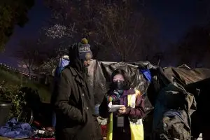 Rocknie Simon who is experiencing homelessness, takes a survey with Lourdes Castro Ramirez on X Street during the Homeless Point-In-Time (PIT) Count on Feb. 24, 2022. Ramirez is the Secretary of the California Business, Consumer Services & Housing Agency.