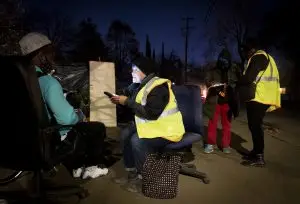 Julio Rodriguez takes a survey from Sacramento Steps Forward Outreach Navigator, Theresa Bible, during the Homeless Point-In-Time (PIT) Count on Feb. 24, 2022