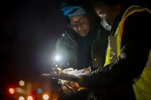 Tamara Knox, right, collects a photo release from Gina Grubbs during the Homeless Point-In-Time (PIT) Count on Feb. 24, 2022