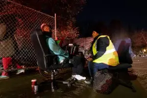 Julio Rodriguez looks toward a shelter being recommended to him by Sacramento Steps Forward Outreach Navigator, Theresa Bible during the Homeless Point-In-Time (PIT) Count on Feb. 24, 2022